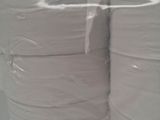 several rolls of toilet paper stacked on top of each other on a shelf