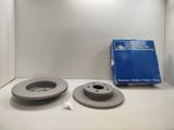 a couple of brake discs are sitting on a counter
