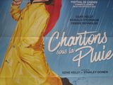 affiche de cinéma représentant une femme en imperméable jaune tenant un parapluie rouge
