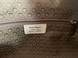 the inside of a coach purse with a tag on it
