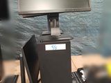 a picture of a computer desk with a monitor and keyboard