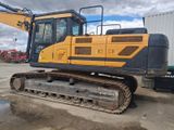 an image of a yellow and black excavator parked in a lot