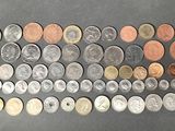 many different types of coins on the table