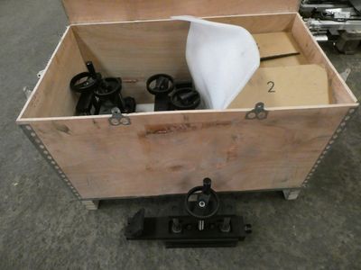 a wooden box that has a bunch of items inside of it
