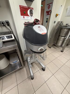 a machine that is sitting in a kitchen next to a stove