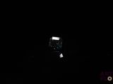 a small box in the middle of a dark room