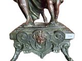 bronze statue of a woman and a child on a pedestal