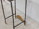 a small table with a wooden top and metal legs