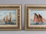 two framed paintings of sailboats on the water in a gold frame
