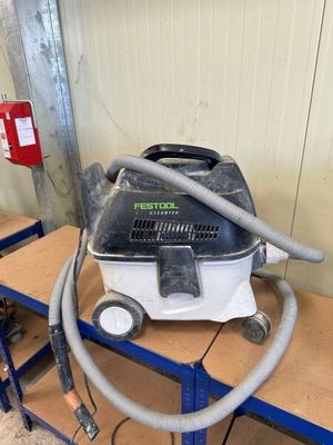 the vacuum is sitting on a cart in the garage