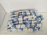 a pile of toothpaste sitting on top of a counter