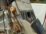 a machine that has a chain attached to the back of it