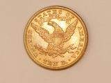 an image of a gold coin on a white surface