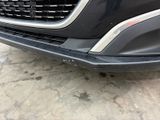 a close up of a car ' s front bumper and grille