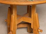a wooden table with a green tile top on it