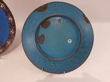 two plates that are sitting next to each other on a table