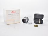 a close up of a camera lens and a box of lenses