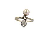 an image of a pearl and diamond ring on a white background