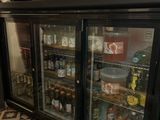 a refrigerator with a lot of drinks inside of it