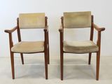 pair of mid - century danish teak armchairs with upholstered cushions