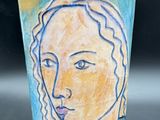 a cup with a picture of a woman on it