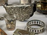 a lot of silver items that are on a table