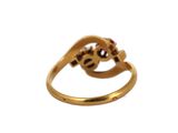 an image of a gold ring with two skulls on it