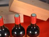 three bottles of wine sitting next to each other on a table