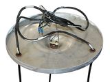 a metal table with a metal plate with wires on it