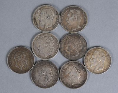 six different types of coins are arranged in a triangle