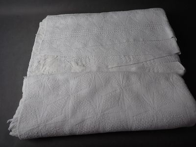 a folded white towel on a black table