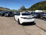 a lot of cars that are parked in a parking lot