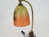 an image of a lamp with a bird on it on a white surface