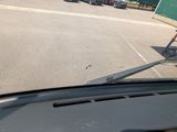 a view of a parking lot from inside of a car