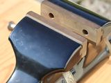 a close up of a metal object on a wooden table