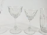 four wine glasses sitting next to each other on a table