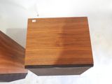 two pieces of wood sitting on top of each other