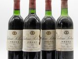 three bottles of red wine sitting next to each other on a white surface