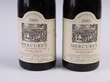 two bottles of wine are sitting next to each other on a table