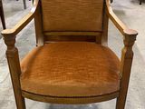 an image of a wooden chair with brown upholstered upholstered seat