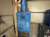a blue machine that is sitting in a garage