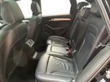 the back seats of a car are empty and the seats are black