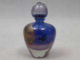 a blue and purple glass bottle with a silver cap