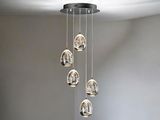 a chandelier made of glass balls hanging from the ceiling