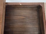 a wooden box that is open on top of a table