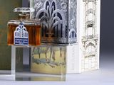 a bottle of honey sitting next to a box of books