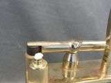 a gold colored faucet that is sitting on a black table
