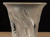 a glass vase that is sitting on a table