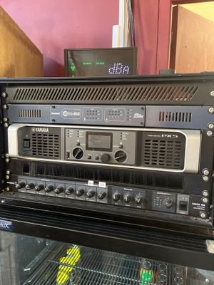 a rack with a bunch of electronics on top of it