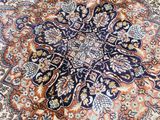 an image of a large oriental rug on a wooden floor